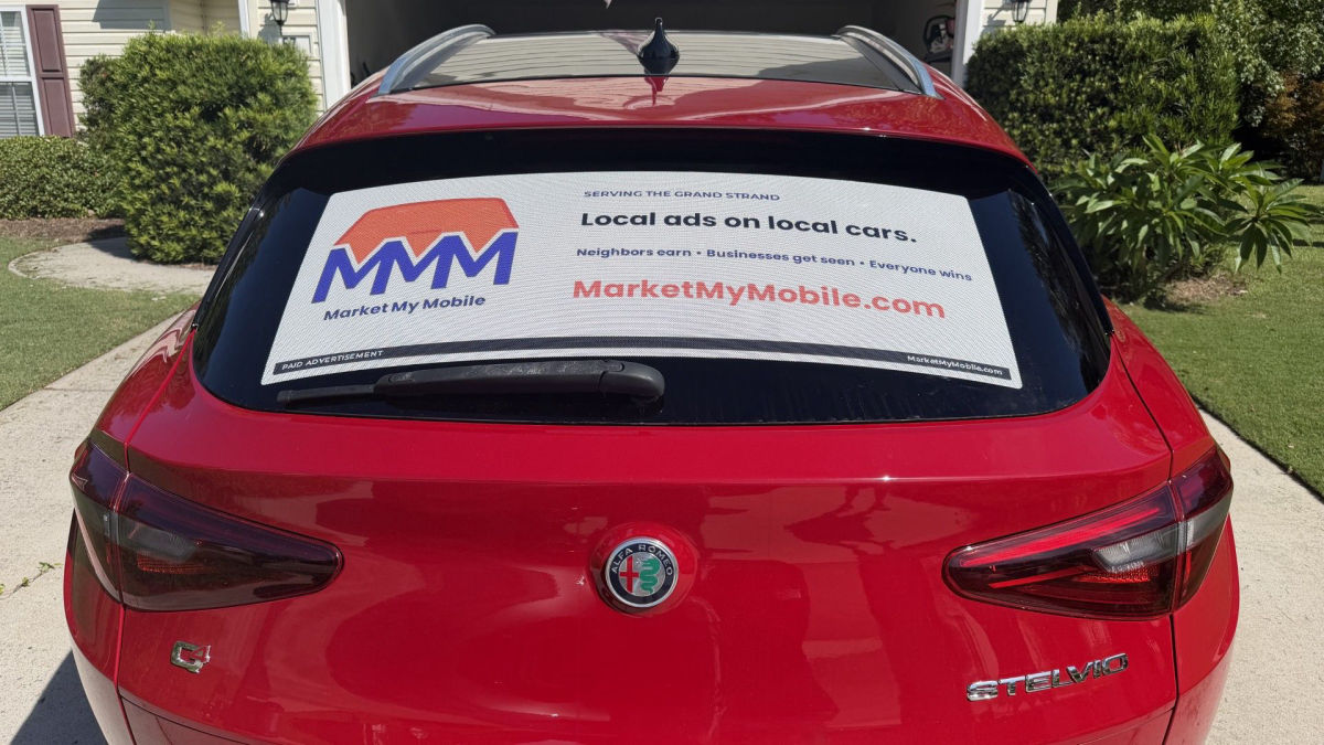 A Market My Mobile ad on the rear window of a car in Murrells Inlet